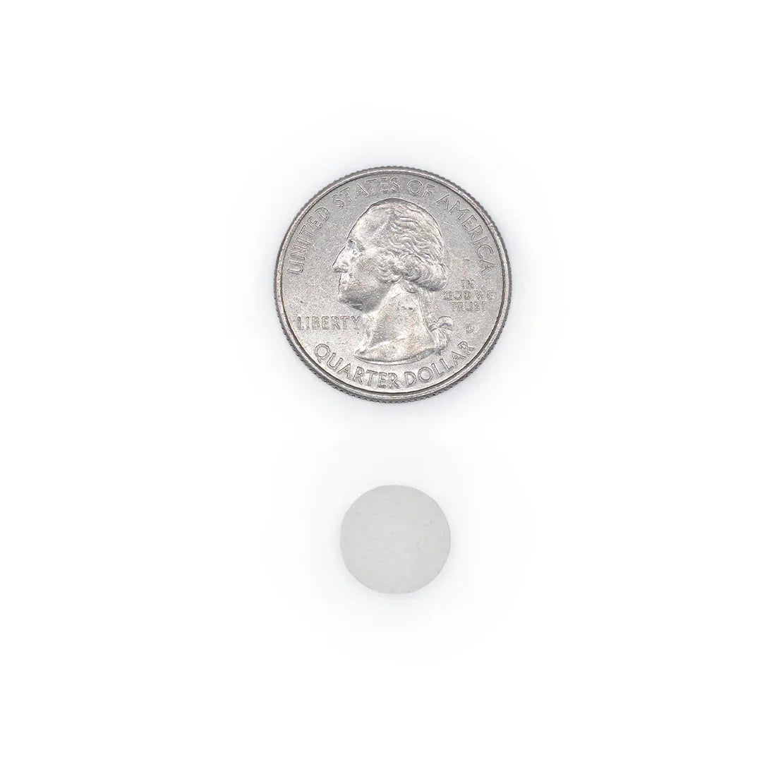 Selenium 200 mcg tablet size comparison with a quarter coin