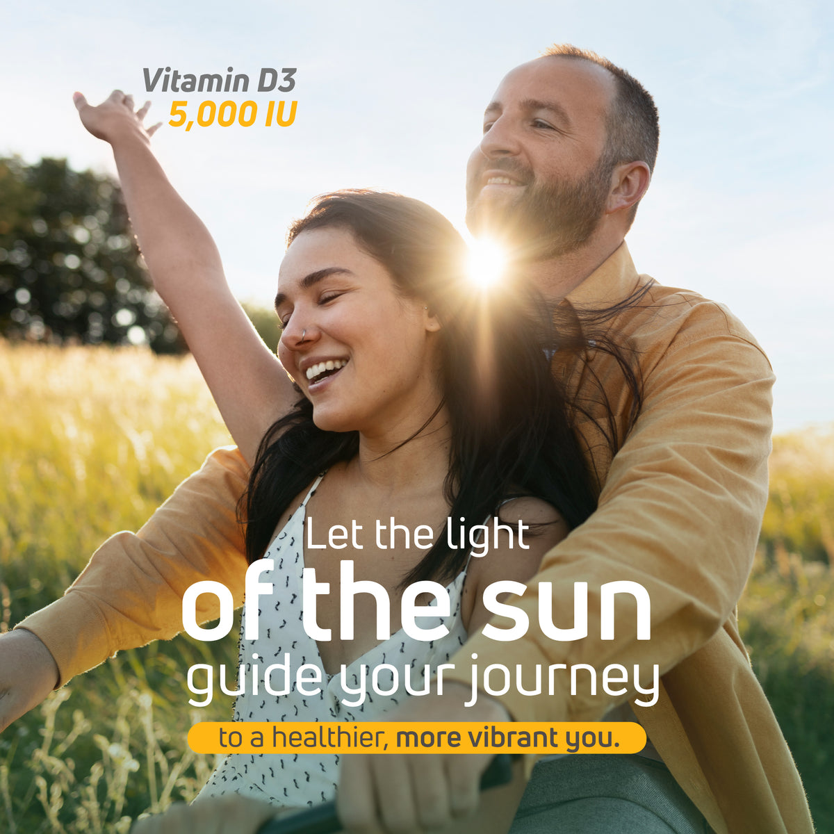 Couple enjoying sunlight in a field with Vitamin D3 5000 IU wellness message.
