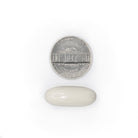 MagX3 white magnesium softgel size comparison with a five cent coin