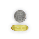 Omega 3 Fish Oil yellow softgel size comparison with a five cent coin