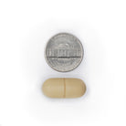 SIMOVE caplet size comparison shown next to a U.S. nickel coin.
