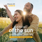 Couple enjoying sunlight in a field with Vitamin D3 5000 IU wellness message.