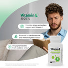 Man reading indoors with Vitamin E 1000 IU softgels for antioxidant and immune system support.