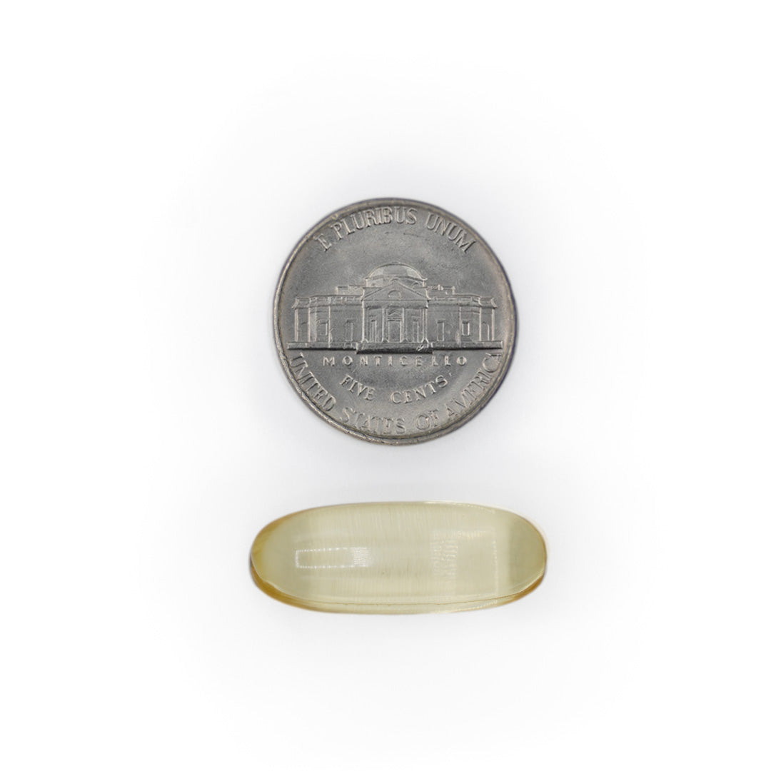 Vitamin E 1000 IU softgel shown next to a coin for size comparison.