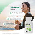 Woman outdoors with Vitamin E 400 IU softgels for antioxidant and immune system support.